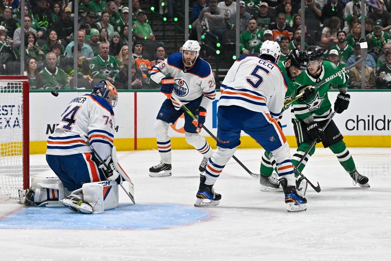 May 25, 2024; Dallas, Texas, USA; Dallas Stars left wing Jamie Benn (14) and center Wyatt Johnston (53) watch as the puck hits the cross bar behind Edmonton Oilers goaltender Stuart Skinner (74) as center Leon Draisaitl (29) and defenseman Cody Ceci (5) look on during the second period in game two of the Western Conference Final of the 2024 Stanley Cup Playoffs at American Airlines Center. Mandatory Credit: Jerome Miron-USA TODAY Sports