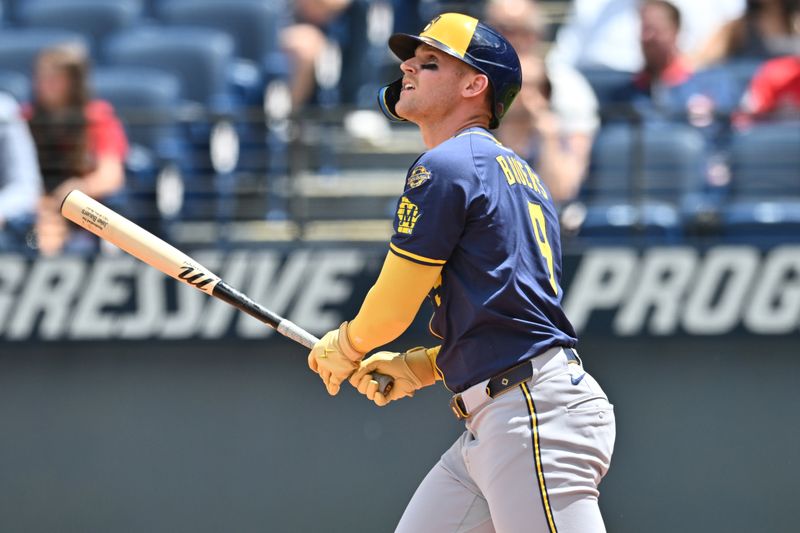 May 14, 2025; Cleveland, Ohio, USA; Milwaukee Brewers left fielder Jake Bauers (9) hits an RBI double during the second inning against the Cleveland Guardians at Progressive Field. Mandatory Credit: Ken Blaze-Imagn Images