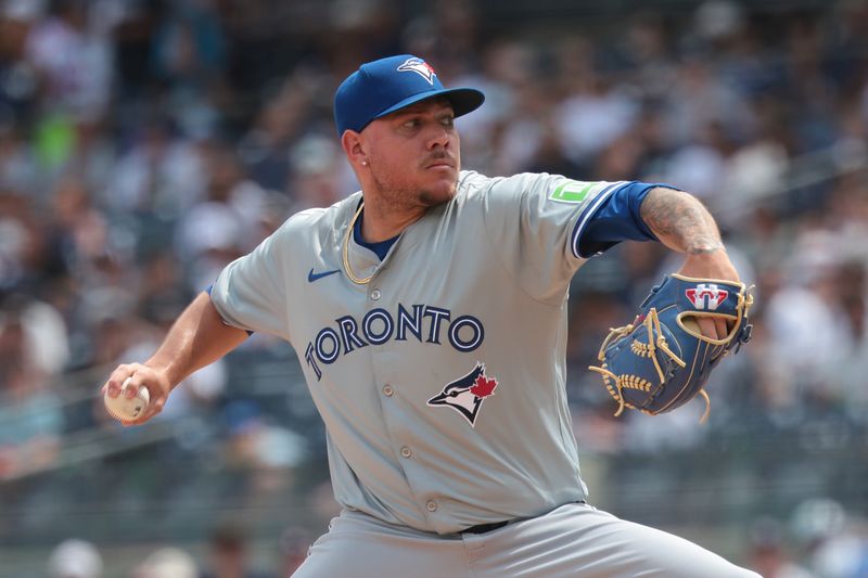 Aug 4, 2024; Bronx, New York, USA; Toronto Blue Jays starting pitcher Yariel Rodriguez (29) delivers a pitch during the first inning against the New York Yankees at Yankee Stadium. Mandatory Credit: Vincent Carchietta-USA TODAY Sports