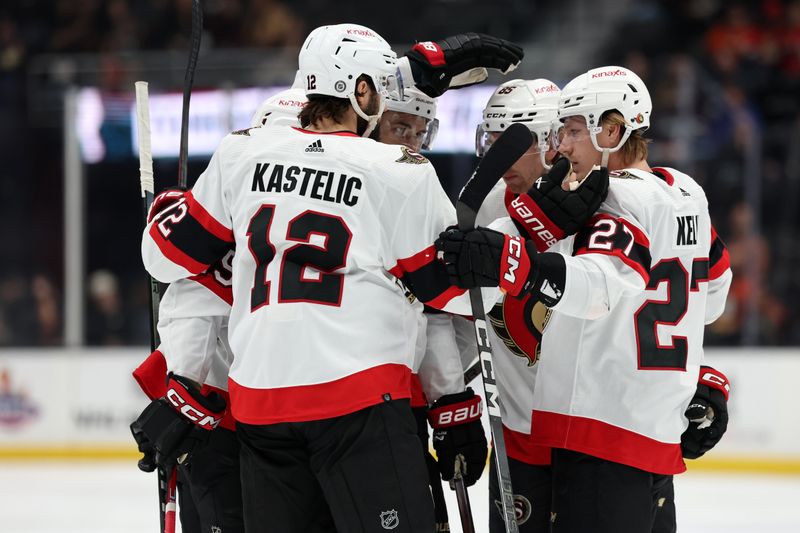 Mar 6, 2024; Anaheim, California, USA;  Ottawa Senators defenseman Artem Zub (2, center) celebrates a goal with center Mark Kastelic (12) and left wing Parker Kelly (27) during the first period against the Anaheim Ducks at Honda Center. Mandatory Credit: Kiyoshi Mio-USA TODAY Sports