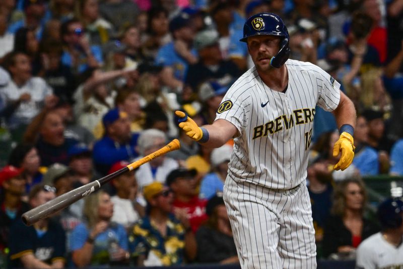 Aug 10, 2024; Milwaukee, Wisconsin, USA; Milwaukee Brewers first baseman Rhys Hoskins (12) reacts after hitting a solo home run in the eighth inning against the Cincinnati Reds at American Family Field. Mandatory Credit: Benny Sieu-USA TODAY Sports