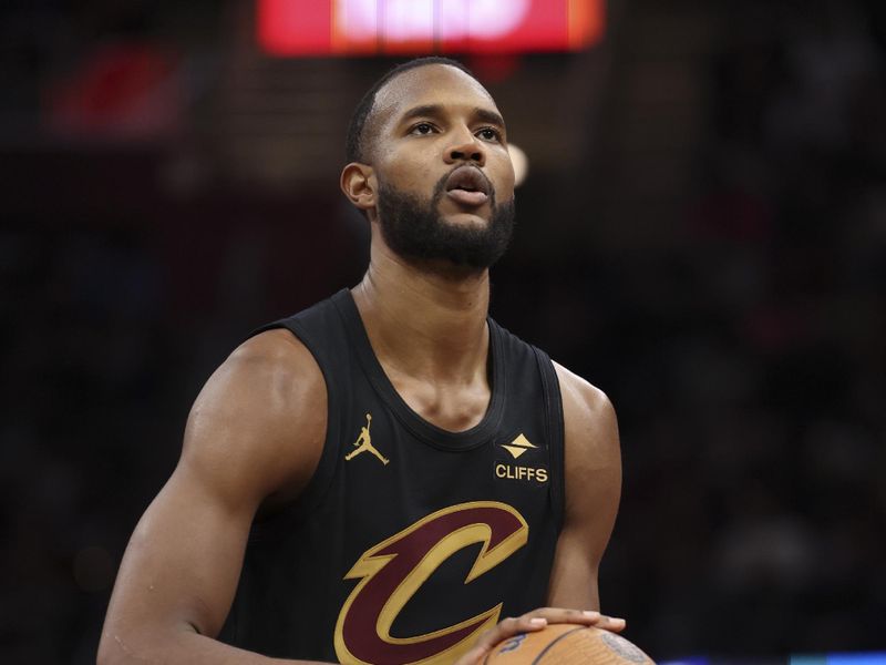 CLEVELAND, OH - DECEMBER 3: Evan Mobley #4 of the Cleveland Cavaliers shoots a free throw during the game against the Washington Wizards in the NBA Cup on December 3, 2024 at Rocket Mortgage FieldHouse in Cleveland, Ohio. NOTE TO USER: User expressly acknowledges and agrees that, by downloading and/or using this Photograph, user is consenting to the terms and conditions of the Getty Images License Agreement. Mandatory Copyright Notice: Copyright 2024 NBAE (Photo by  Lauren Leigh Bacho/NBAE via Getty Images)