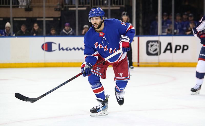 Jan 18, 2025; New York, New York, USA; New York Rangers center Vincent Trocheck (16) skates toward the puck against the Columbus Blue Jackets during the first period at Madison Square Garden. Mandatory Credit: Danny Wild-Imagn Images