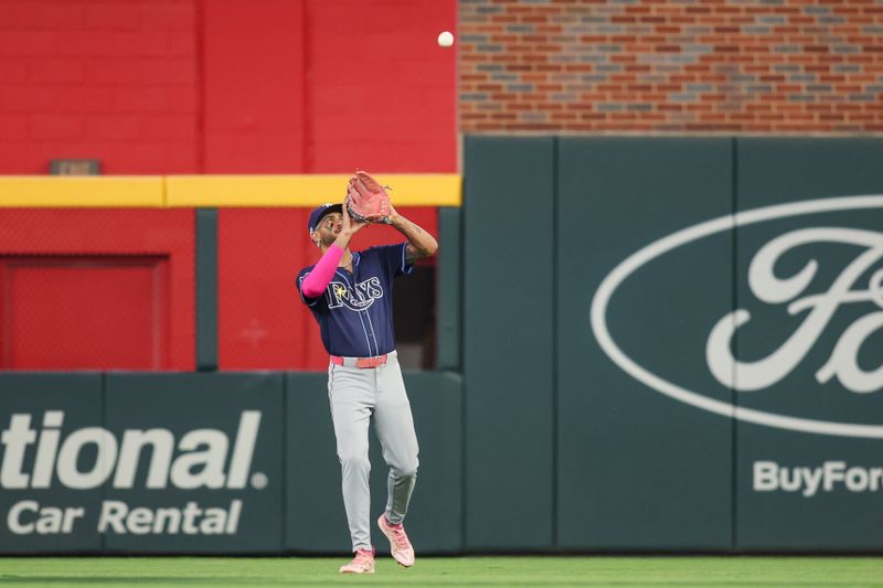Jun 14, 2024; Atlanta, Georgia, USA; Tampa Bay Rays center fielder Jose Siri (22) catches a fly ball against the Atlanta Braves in the sixth inning at Truist Park. Mandatory Credit: Brett Davis-USA TODAY Sports
