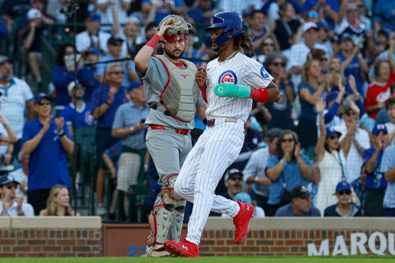 Sep 28, 2025; Chicago, Illinois, USA; Chicago Cubs outfielder Kevin Alcantara (13) scores against the St. Louis Cardinals during the seventh inning at Wrigley Field. Mandatory Credit: Kamil Krzaczynski-Imagn Images