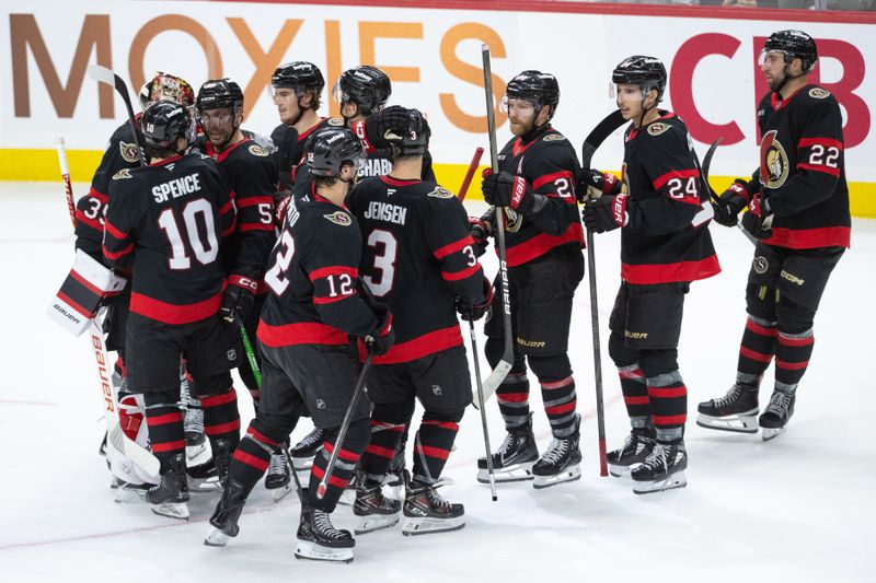 Oct 30, 2025; Ottawa, Ontario, CAN; The Ottawa Senators celebrate their win against the Calgary Flames in a shootout at the Canadian Tire Centre. Mandatory Credit: Marc DesRosiers-IMAGN Images