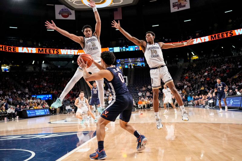 Dec 31, 2022; Atlanta, Georgia, USA; Georgia Tech Yellow Jackets guard Dallan Coleman (3) and forward Jalon Moore (14) defend against Virginia Cavaliers guard Kihei Clark (0) during the second half at McCamish Pavilion. Mandatory Credit: Dale Zanine-USA TODAY Sports