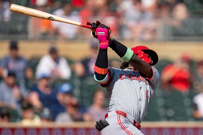Sep 15, 2024; Minneapolis, Minnesota, USA; Cincinnati Reds shortstop Elly De La Cruz (44) hits a single against the Minnesota Twins in the fifth inning at Target Field. Mandatory Credit: Jesse Johnson-Imagn Images