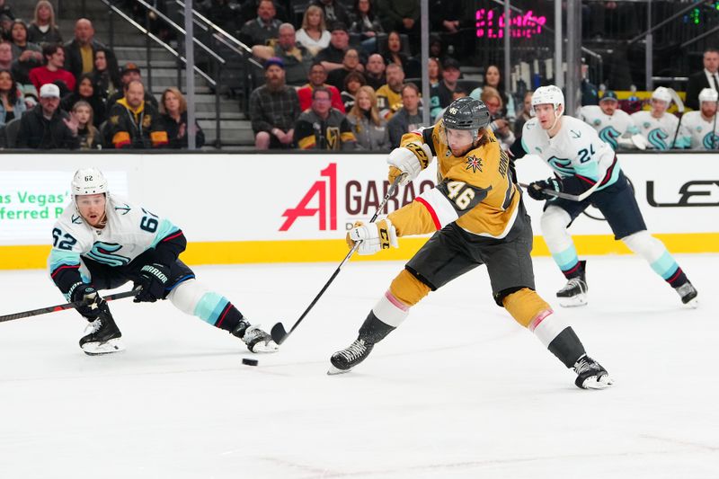 Jan 31, 2026; Las Vegas, Nevada, USA; Vegas Golden Knights right wing Jonas Rondbjerg (46) shoots behind Seattle Kraken defenseman Brandon Montour (62) during the first period at T-Mobile Arena. Mandatory Credit: Stephen R. Sylvanie-Imagn Images