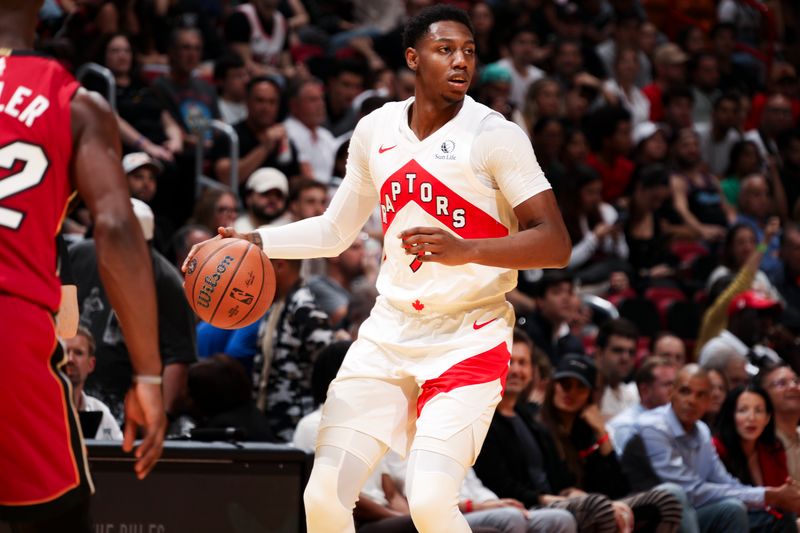 MIAMI, FL - NOVEMBER 29: RJ Barrett #9 of the Toronto Raptors dribbles the ball during the game against the Miami Heat in the NBA Cup on November 29, 2024 at Kaseya Center in Miami, Florida. NOTE TO USER: User expressly acknowledges and agrees that, by downloading and or using this Photograph, user is consenting to the terms and conditions of the Getty Images License Agreement. Mandatory Copyright Notice: Copyright 2024 NBAE (Photo by Issac Baldizon/NBAE via Getty Images)