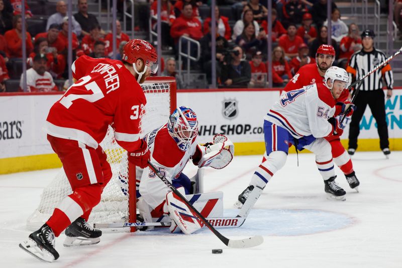 Apr 15, 2024; Detroit, Michigan, USA;  Montreal Canadiens goaltender Sam Montembeault (35) makes a save on Detroit Red Wings left wing J.T. Compher (37) in the second period at Little Caesars Arena. Mandatory Credit: Rick Osentoski-USA TODAY Sports