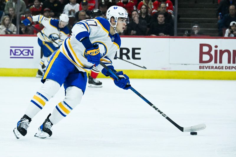 Oct 19, 2024; Chicago, Illinois, USA;  Buffalo Sabres left wing Jason Zucker (17) moves the puck against the Chicago Blackhawks during the first period at the United Center. Mandatory Credit: Matt Marton-Imagn Images