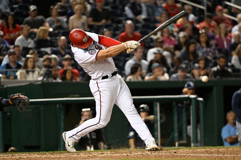 Apr 4, 2023; Washington, District of Columbia, USA; Washington Nationals catcher Riley Adams (15) singles against the Tampa Bay Rays during the fifth inning at Nationals Park. Mandatory Credit: Brad Mills-USA TODAY Sports