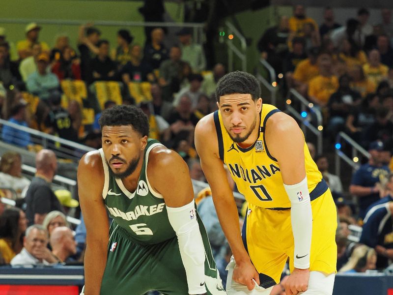 INDIANAPOLIS, IN - APRIL 28: Tyrese Haliburton #0 of the Indiana Pacers and Malik Beasley #5 of the Milwaukee Bucks look on during the game during Round 1 Game 4 of the 2024 NBA Playoffs on April 28, 2024 at Gainbridge Fieldhouse in Indianapolis, Indiana. NOTE TO USER: User expressly acknowledges and agrees that, by downloading and or using this Photograph, user is consenting to the terms and conditions of the Getty Images License Agreement. Mandatory Copyright Notice: Copyright 2024 NBAE (Photo by Ron Hoskins/NBAE via Getty Images)