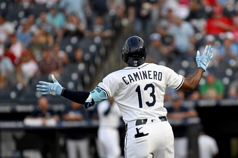 May 8, 2025; St. Petersburg, Florida, USA; Tampa Bay Rays third baseman Junior Caminero (13) celebrates after hitting a solo home run  in the first inning against the Philadelphia Phillies at George M. Steinbrenner Field. Mandatory Credit: Jonathan Dyer-Imagn Images