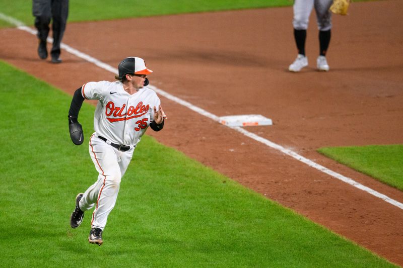 Aug 29, 2023; Baltimore, Maryland, USA; Baltimore Orioles catcher Adley Rutschman (35) scores a run during the eighth inning against the Chicago White Sox at Oriole Park at Camden Yards. Mandatory Credit: Reggie Hildred-USA TODAY Sports