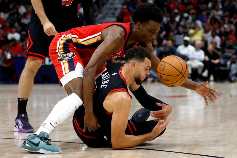 NEW ORLEANS, LOUISIANA - OCTOBER 23:  Herbert Jones #2 of the New Orleans Pelicans steals the ball from Zach LaVine #8 of the Chicago Bulls during the second quarter of an NBA game at Smoothie King Center on October 23, 2024 in New Orleans, Louisiana. NOTE TO USER: User expressly acknowledges and agrees that, by downloading and or using this photograph, User is consenting to the terms and conditions of the Getty Images License Agreement. (Photo by Sean Gardner/Getty Images)