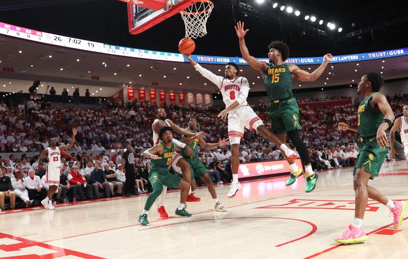 Feb 10, 2025; Houston, Texas, USA; Houston Cougars guard Mylik Wilson (8) scores against the Baylor Bears forward Norchad Omier (15) in the first half at Fertitta Center. Mandatory Credit: Thomas Shea-Imagn Images