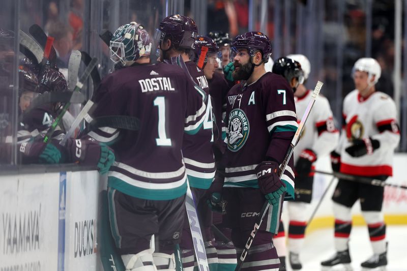 Mar 6, 2024; Anaheim, California, USA;  Anaheim Ducks goaltender Lukas Dostal (1) and defenseman Cam Fowler (4) and defenseman Radko Gudas (7) stand in front of the bench during the time out in the third period against the Ottawa Senators at Honda Center. Mandatory Credit: Kiyoshi Mio-USA TODAY Sports