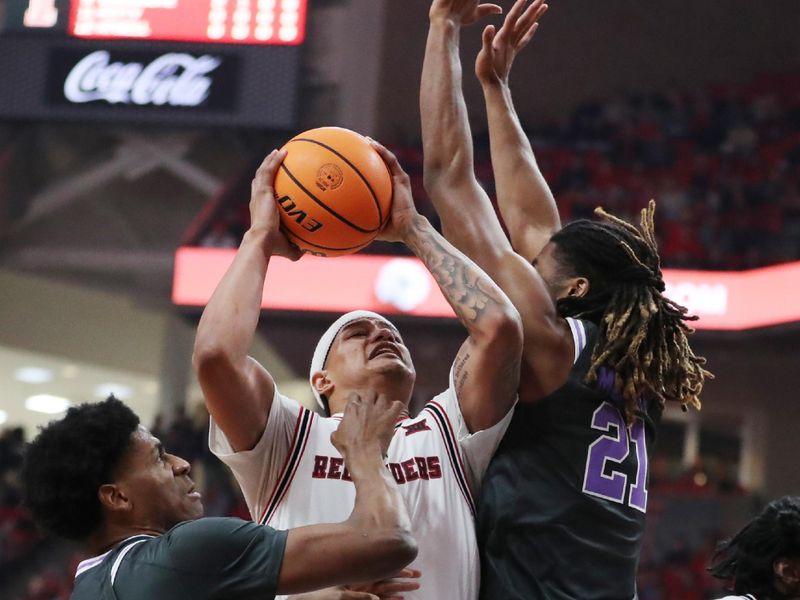 Feb 21, 2026; Lubbock, Texas, USA;   Texas Tech Red Raiders forward LeJuan Watts (3) shoots against Kansas State Wildcats Khamari McGriff (21) in the first half at United Supermarkets Arena. Mandatory Credit: Michael C. Johnson-Imagn Images