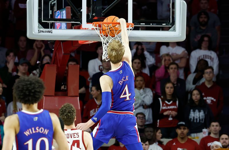 Feb 11, 2023; Norman, Oklahoma, USA; Kansas Jayhawks guard Gradey Dick (4) dunks against the Oklahoma Sooners during the second half at Lloyd Noble Center. Kansas won 78-55. Mandatory Credit: Alonzo Adams-USA TODAY Sports