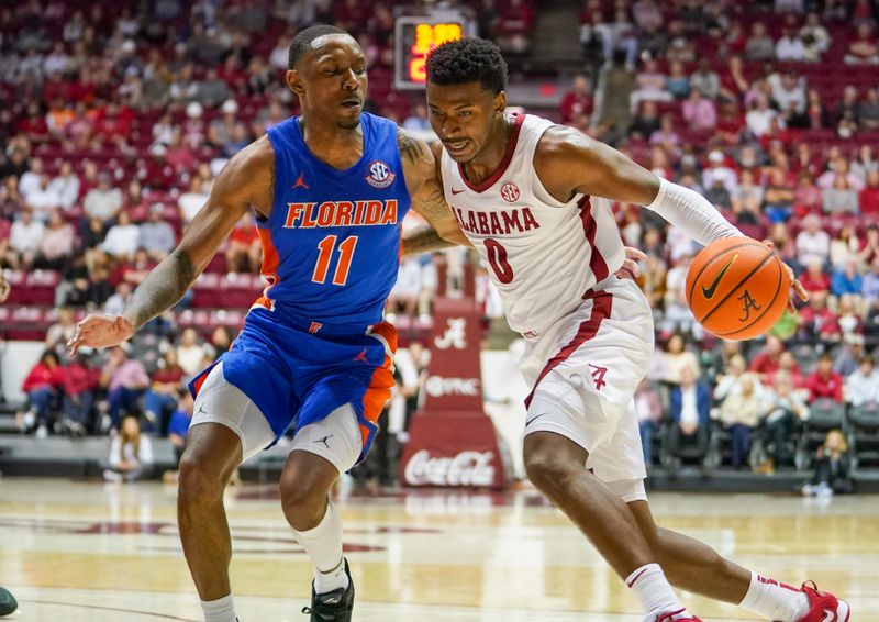 Feb 8, 2023; Tuscaloosa, Alabama, USA; Alabama Crimson Tide guard Jaden Bradley (0) drives to the basket against Florida Gators guard Kyle Lofton (11) during the second half at Coleman Coliseum. Mandatory Credit: Marvin Gentry-USA TODAY Sports