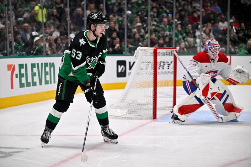 Jan 4, 2026; Dallas, Texas, USA; Dallas Stars center Wyatt Johnston (53) looks for the puck in front of Montreal Canadiens goaltender Sam Montembeault (35) during the second period at the American Airlines Center. Mandatory Credit: Jerome Miron-Imagn Images