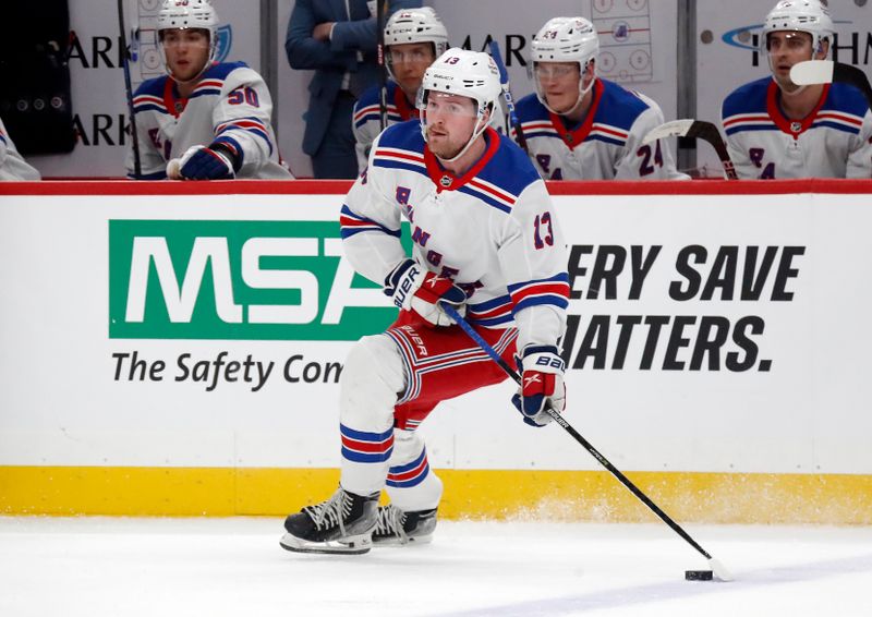 Nov 22, 2023; Pittsburgh, Pennsylvania, USA; New York Rangers left wing Alexis Lafreniere (13) skates with the puck against the Pittsburgh Penguins during the first period at PPG Paints Arena. Mandatory Credit: Charles LeClaire-USA TODAY Sports