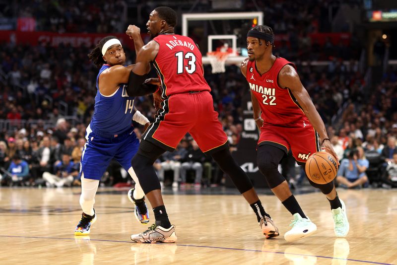 LOS ANGELES, CALIFORNIA - JANUARY 02: Jimmy Butler #22 of the Miami Heat drives past Terance Mann #14 of the Los Angeles Clippers during the third quarter at Crypto.com Arena on January 02, 2023 in Los Angeles, California. NOTE TO USER: User expressly acknowledges and agrees that, by downloading and or using this photograph, User is consenting to the terms and conditions of the Getty Images License Agreement. (Photo by Katelyn Mulcahy/Getty Images)