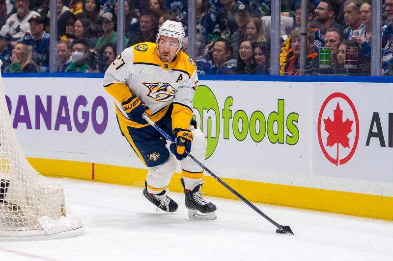 Apr 21, 2024; Vancouver, British Columbia, CAN; Nashville Predators defenseman Ryan McDonagh (27) handles the puck against the Vancouver Canucks in the first period in game one of the first round of the 2024 Stanley Cup Playoffs at Rogers Arena. Mandatory Credit: Bob Frid-USA TODAY Sports