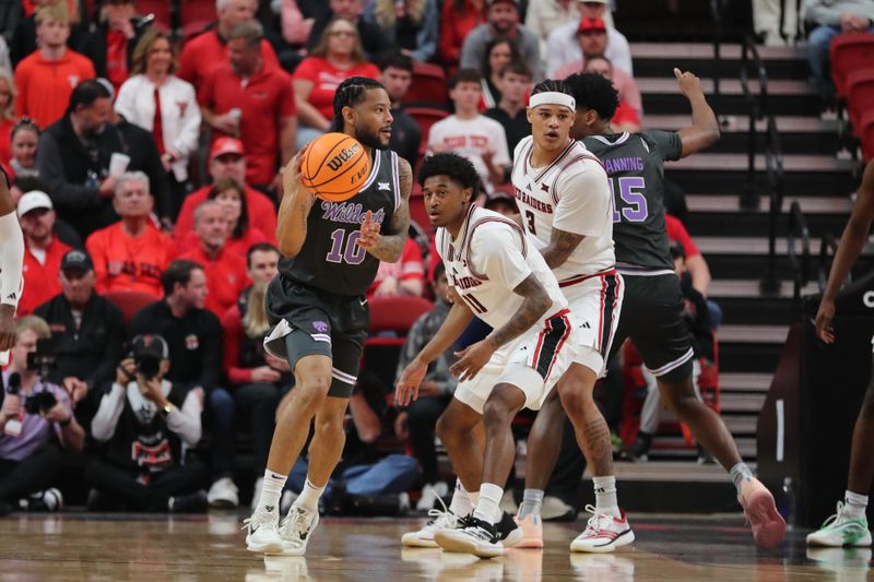 Feb 21, 2026; Lubbock, Texas, USA;  Kansas State Wildcats David Castillo (10) dribbles the ball against Texas Tech Red Raiders guard Jaylen Petty (11) in the first half at United Supermarkets Arena. Mandatory Credit: Michael C. Johnson-Imagn Images