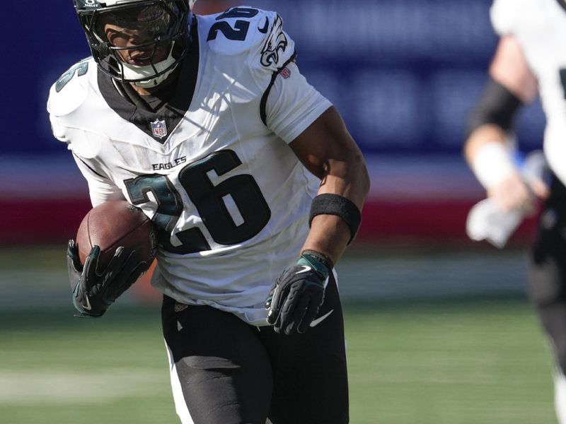 Philadelphia Eagles running back Saquon Barkley (26) carries the ball against the New York Giants during the third quarter of an NFL football game, Sunday, Oct. 20, 2024, in East Rutherford, N.J. (AP Photo/Seth Wenig)