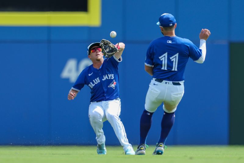 Mar 20, 2025; Dunedin, Florida, USA; Toronto Blue Jays outfielder Myles Straw (3) catches a fly ball for an out against the Tampa Bay Rays in the sixth inning during spring training at TD Ballpark. Mandatory Credit: Nathan Ray Seebeck-Imagn Images