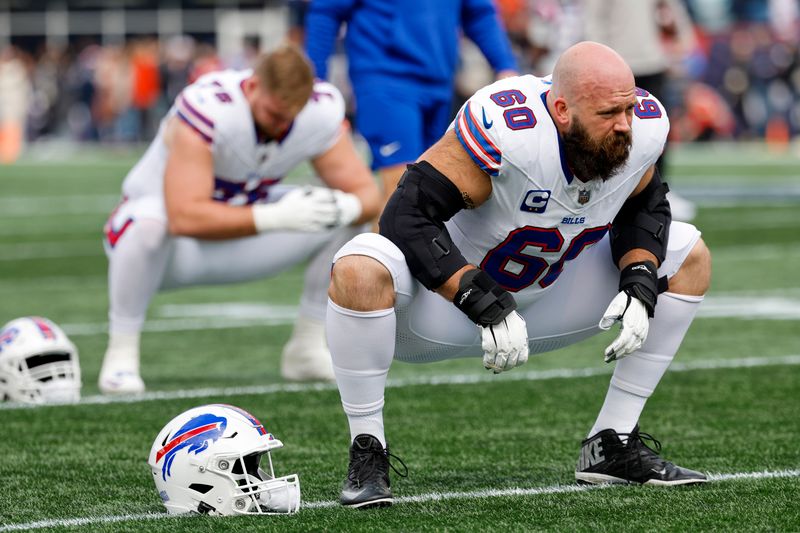 Buffalo Bills center Mitch Morse (60) stretches before an NFL football game against the New England Patriots on Sunday, Oct. 22, 2023, in Foxborough, Mass. (AP Photo/Greg M. Cooper)