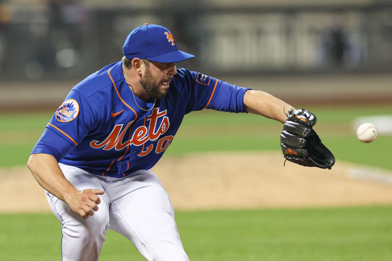 Jun 29, 2023; New York City, New York, USA; New York Mets relief pitcher Dominic Leone (50) catches the ball to force out Milwaukee Brewers second baseman Brice Turang (not pictured) during the seventh inning at Citi Field. Mandatory Credit: Vincent Carchietta-USA TODAY Sports