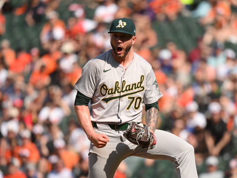 Apr 28, 2024; Baltimore, Maryland, USA;  Oakland Athletics relief pitcher Lucas Erceg (70) reacts to a strikeout to end the game during the ninth inning against the Oakland Athletics at Oriole Park at Camden Yards. Mandatory Credit: James A. Pittman-USA TODAY Sports