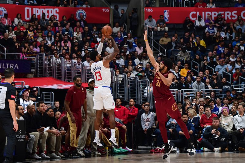 LOS ANGELES, CA - APRIL 7: Paul George #13 of the LA Clippers shoots the ball during the game against the Cleveland Cavaliers on April 7, 2024 at Crypto.Com Arena in Los Angeles, California. NOTE TO USER: User expressly acknowledges and agrees that, by downloading and/or using this Photograph, user is consenting to the terms and conditions of the Getty Images License Agreement. Mandatory Copyright Notice: Copyright 2024 NBAE (Photo by Adam Pantozzi/NBAE via Getty Images)