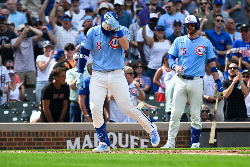 Sep 12, 2025; Chicago, Illinois, USA;  Chicago Cubs outfielder Ian Happ (8) crosses home plate after hitting a home run during the fourth inning against the Tampa Bay Rays at Wrigley Field. Mandatory Credit: Matt Marton-Imagn Images