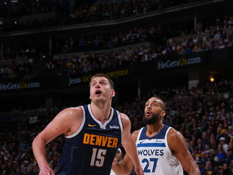 DENVER, CO - APRIL 10: Nikola Jokic #15 of the Denver Nuggets boxes out against Rudy Gobert #27 of the Minnesota Timberwolves during the game on April 10, 2024 at the Ball Arena in Denver, Colorado. NOTE TO USER: User expressly acknowledges and agrees that, by downloading and/or using this Photograph, user is consenting to the terms and conditions of the Getty Images License Agreement. Mandatory Copyright Notice: Copyright 2024 NBAE (Photo by Bart Young/NBAE via Getty Images)