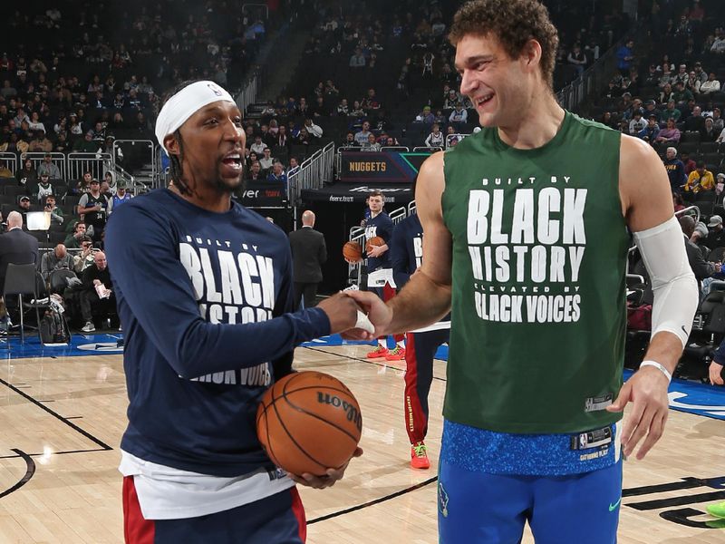 MILWAUKEE, WI - FEBRUARY 12: Kentavious Caldwell-Pope #5 of the Denver Nuggets and Brook Lopez #11 of the Milwaukee Bucks embrace before the game on February 12, 2024 at the Fiserv Forum Center in Milwaukee, Wisconsin. NOTE TO USER: User expressly acknowledges and agrees that, by downloading and or using this Photograph, user is consenting to the terms and conditions of the Getty Images License Agreement. Mandatory Copyright Notice: Copyright 2024 NBAE (Photo by Gary Dineen/NBAE via Getty Images).