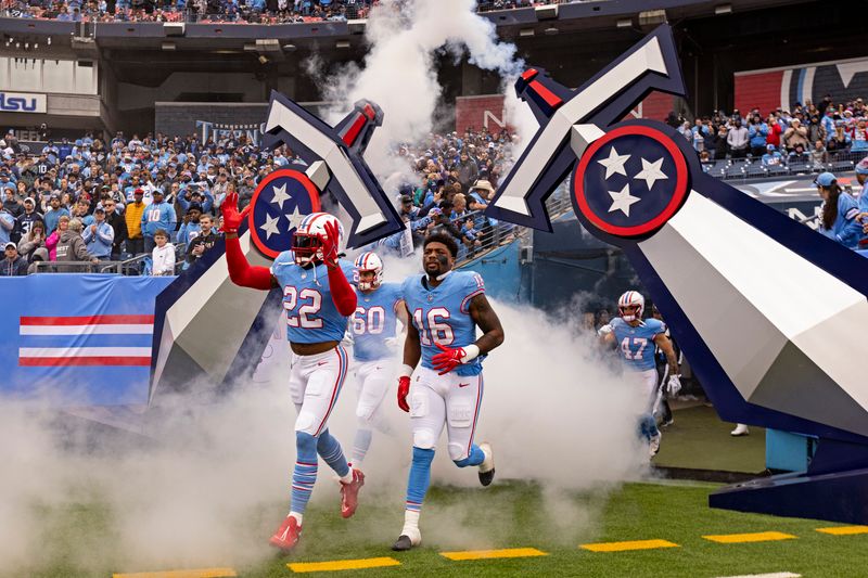 Tennessee Titans running back Derrick Henry (22), wide receiver Treylon Burks (16), offensive tackle Daniel Brunskill (60) take the field before their NFL football game against the Houston Texans Sunday, Dec. 17, 2023, in Nashville, Tenn. (AP Photo/Wade Payne)