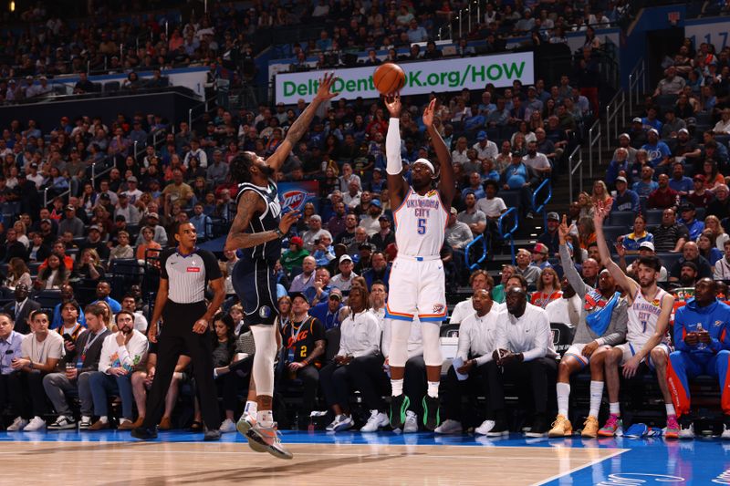 OKLAHOMA CITY, OK - MARCH 14: Luguentz Dort #5 of the Oklahoma City Thunder shoots a three point basket against the Dallas Mavericks on March 13, 2024 at Paycom Arena in Oklahoma City, Oklahoma. NOTE TO USER: User expressly acknowledges and agrees that, by downloading and or using this photograph, User is consenting to the terms and conditions of the Getty Images License Agreement. Mandatory Copyright Notice: Copyright 2024 NBAE (Photo by Zach Beeker/NBAE via Getty Images)