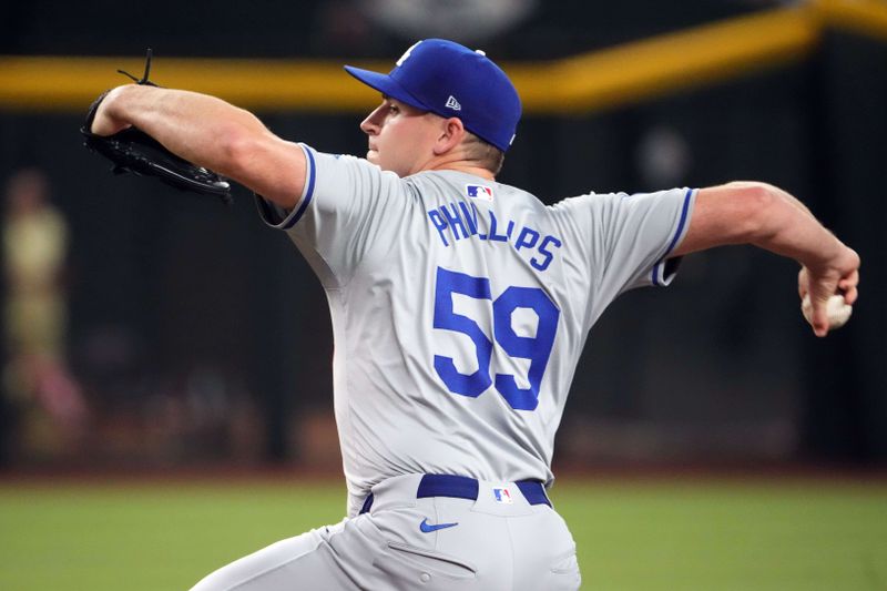Aug 31, 2024; Phoenix, Arizona, USA; Los Angeles Dodgers pitcher Evan Phillips (59) pitches against the Arizona Diamondbacks during the ninth inning at Chase Field. Mandatory Credit: Joe Camporeale-USA TODAY Sports