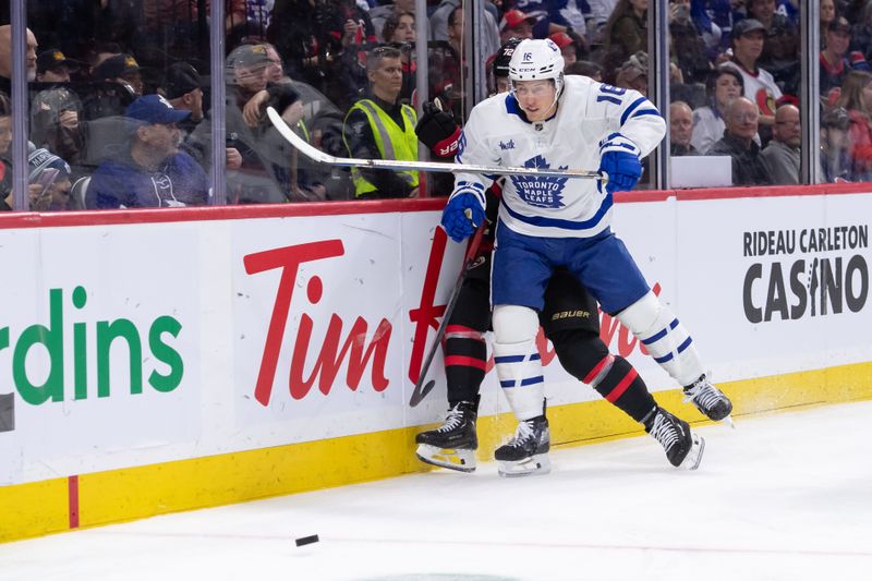 Feb 10, 2024; Ottawa, Ontario, CAN; Ottawa Senators defenseman Thomas Chabot (72) is taken off the puck by Toronto Maple Leafs right wing Mitchell Marner (16) in the second period at the Canadian Tire Centre. Mandatory Credit: Marc DesRosiers-USA TODAY Sports