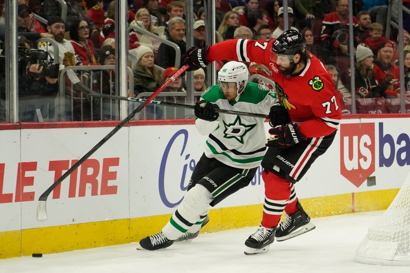 Nov 27, 2024; Chicago, Illinois, USA; Dallas Stars defenseman Ilya Lyubushkin (46) and Chicago Blackhawks left wing Patrick Maroon (77) go for the puck during the third period at United Center. Mandatory Credit: David Banks-Imagn Images