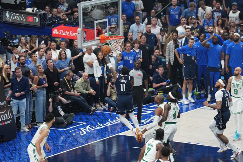 DALLAS, TX - JUNE 14: Kyrie Irving #11 of the Dallas Mavericks drives to the basket during the game against the Boston Celtics during Game Four of the 2024 NBA Finals on June 14, 2024 at the American Airlines Center in Dallas, Texas. NOTE TO USER: User expressly acknowledges and agrees that, by downloading and or using this photograph, User is consenting to the terms and conditions of the Getty Images License Agreement. Mandatory Copyright Notice: Copyright 2024 NBAE (Photo by Glenn James/NBAE via Getty Images)