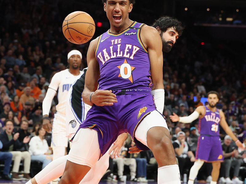 PHOENIX, ARIZONA - NOVEMBER 18: Ryan Dunn #0 of the Phoenix Suns reacts to a slam dunk against the Orlando Magic during the second half of the NBA game at Footprint Center on November 18, 2024 in Phoenix, Arizona.  NOTE TO USER: User expressly acknowledges and agrees that, by downloading and/or using this photograph, user is consenting to the terms and conditions of the Getty Images License Agreement. (Photo by Christian Petersen/Getty Images)