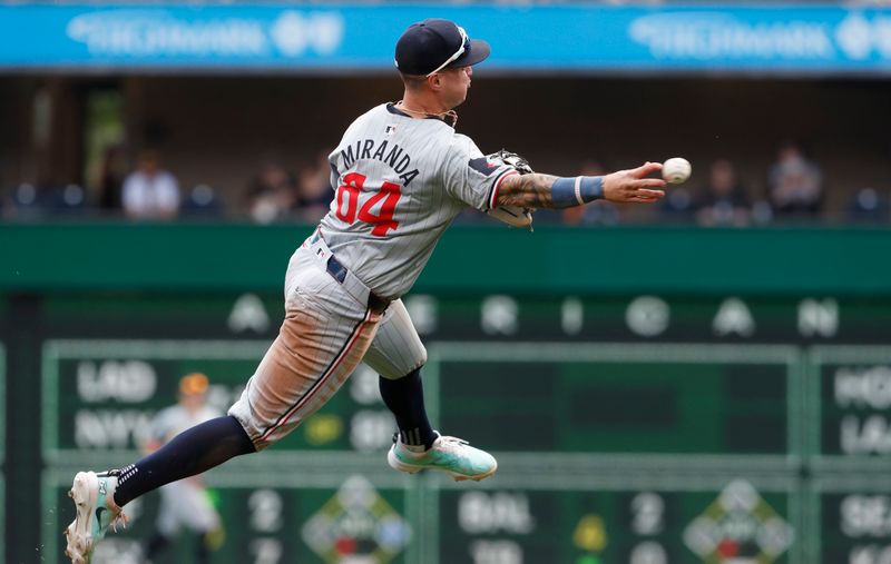 Jun 9, 2024; Pittsburgh, Pennsylvania, USA; Minnesota Twins third baseman Jose Miranda (64) throws the ball to first base too late to retire Pittsburgh Pirates second baseman Nick Gonzales (not pictured) during the fourth inning at PNC Park. Mandatory Credit: Charles LeClaire-USA TODAY Sports