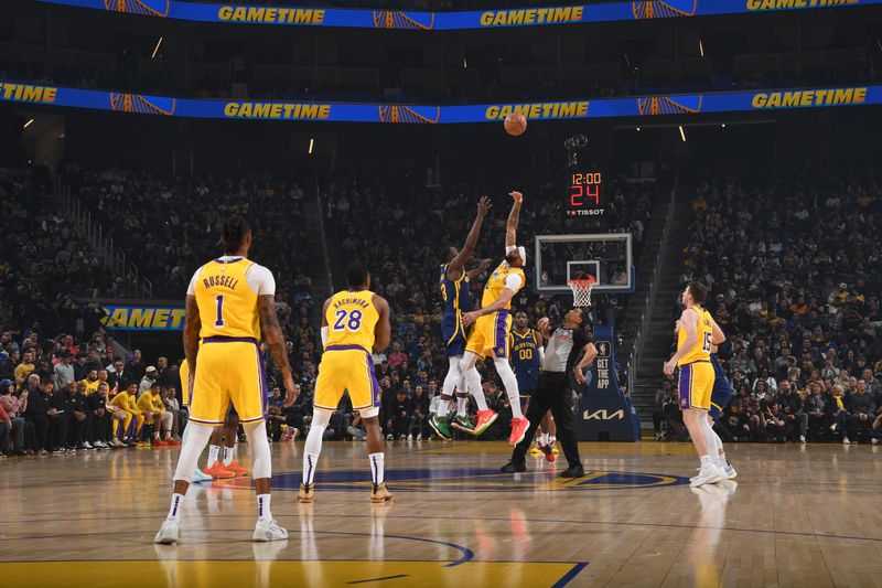 SAN FRANCISCO, CA - FEBRUARY 22:  Opening tip-off between Draymond Green #23 of the Golden State Warriors & Anthony Davis #3 of the Los Angeles Lakers on February 22, 2024 at Chase Center in San Francisco, California. NOTE TO USER: User expressly acknowledges and agrees that, by downloading and or using this photograph, user is consenting to the terms and conditions of Getty Images License Agreement. Mandatory Copyright Notice: Copyright 2024 NBAE (Photo by Noah Graham/NBAE via Getty Images)