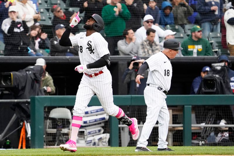 May 14, 2023; Chicago, Illinois, USA; Chicago White Sox center fielder Luis Robert Jr. (88) runs the bases after hitting a home run against the Houston Astros during the fourth inning at Guaranteed Rate Field. Mandatory Credit: David Banks-USA TODAY Sports